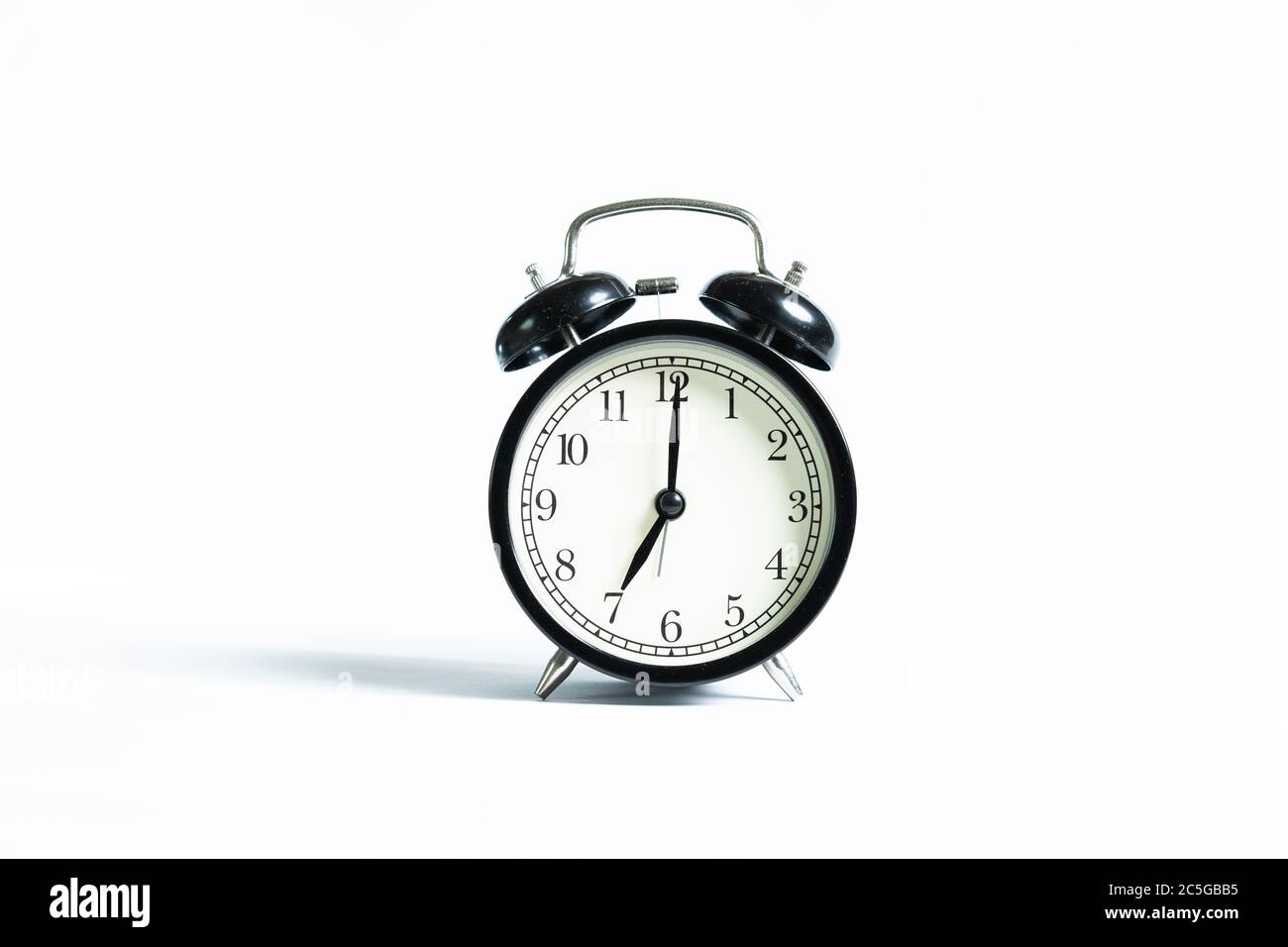 A black alarm clock isolated against white background Stock Photo