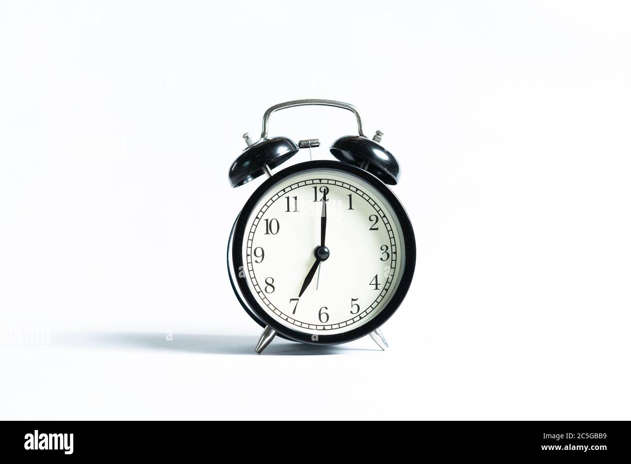 A black alarm clock isolated against white background Stock Photo