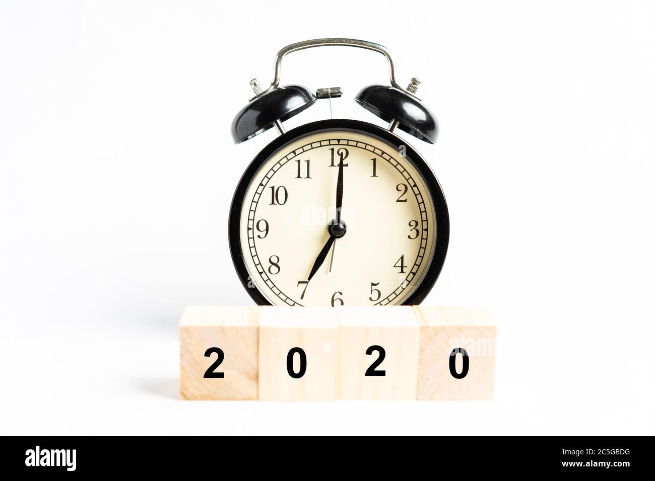 A black alarm clock isolated against white background Stock Photo - Alamy