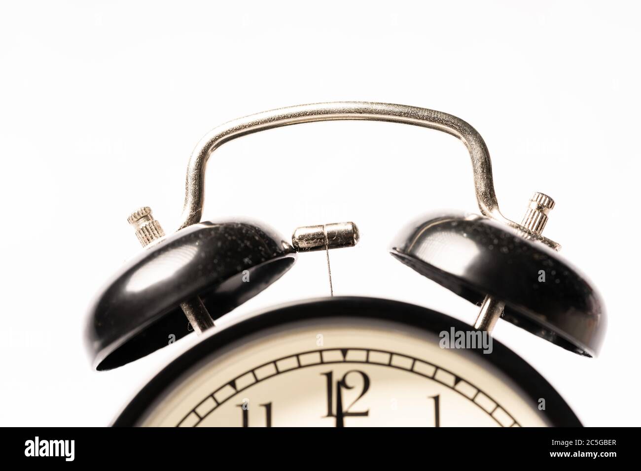 A black alarm clock isolated against white background Stock Photo