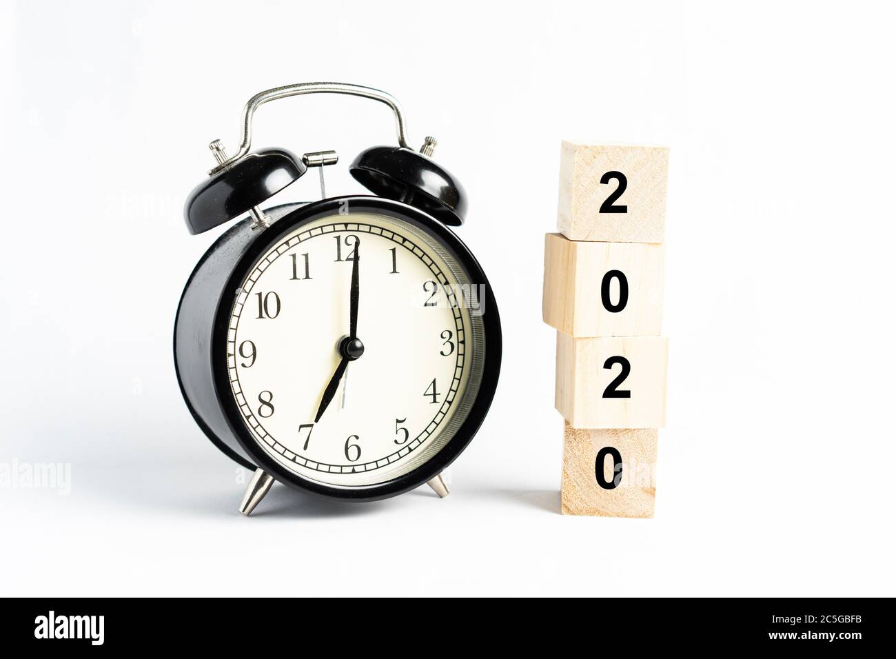 A black alarm clock isolated against white background Stock Photo - Alamy