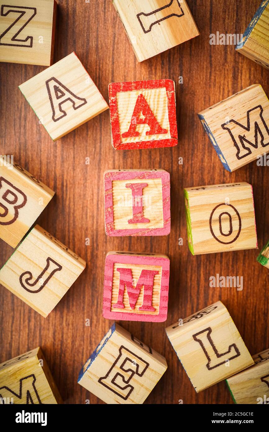 “AIM” wordings on wooden blocks, suitable for motivational wallpaper