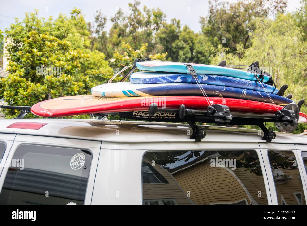 A stack of surfboards on top of a van; Mission Viejo, California. Stock Photo