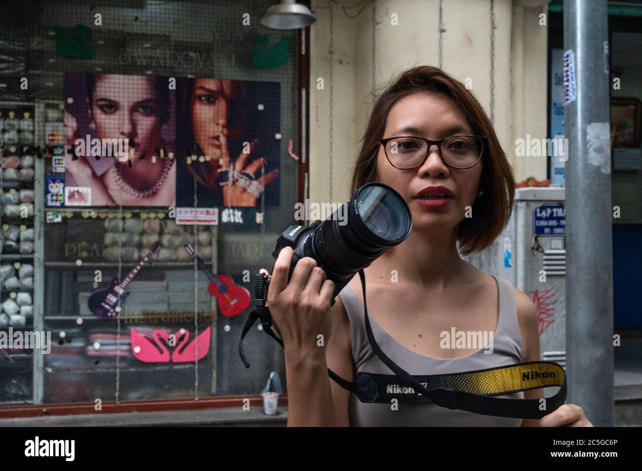 Portrait of a female Vietnamese photographer, Ho Chi Minh City, Vietnam Stock Photo