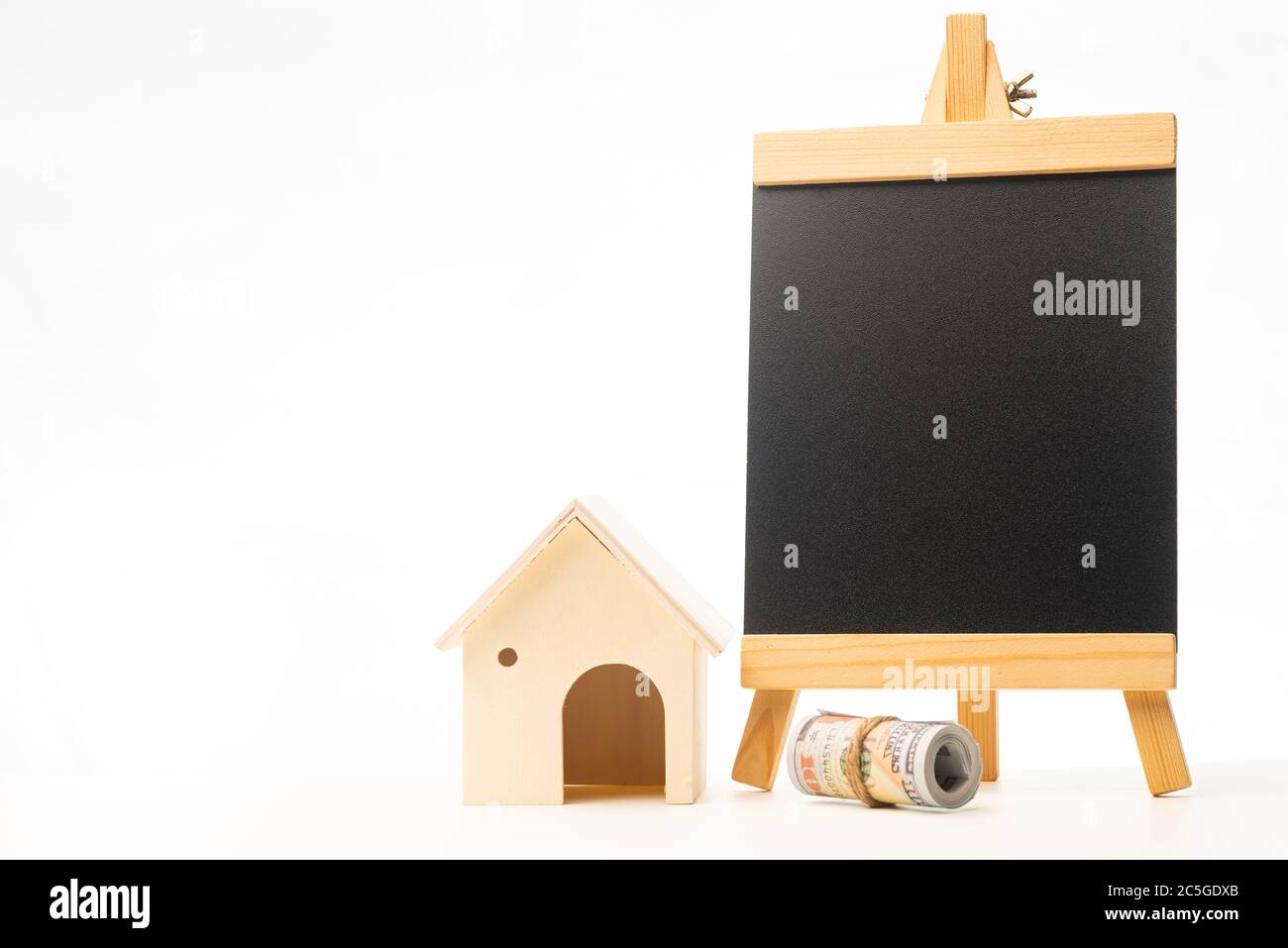 Miniature wooden house isolated against white background Stock Photo ...