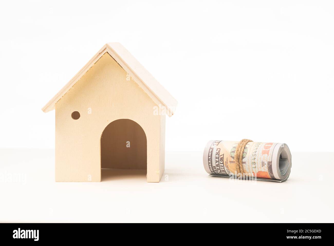 Miniature wooden house isolated against white background Stock Photo ...