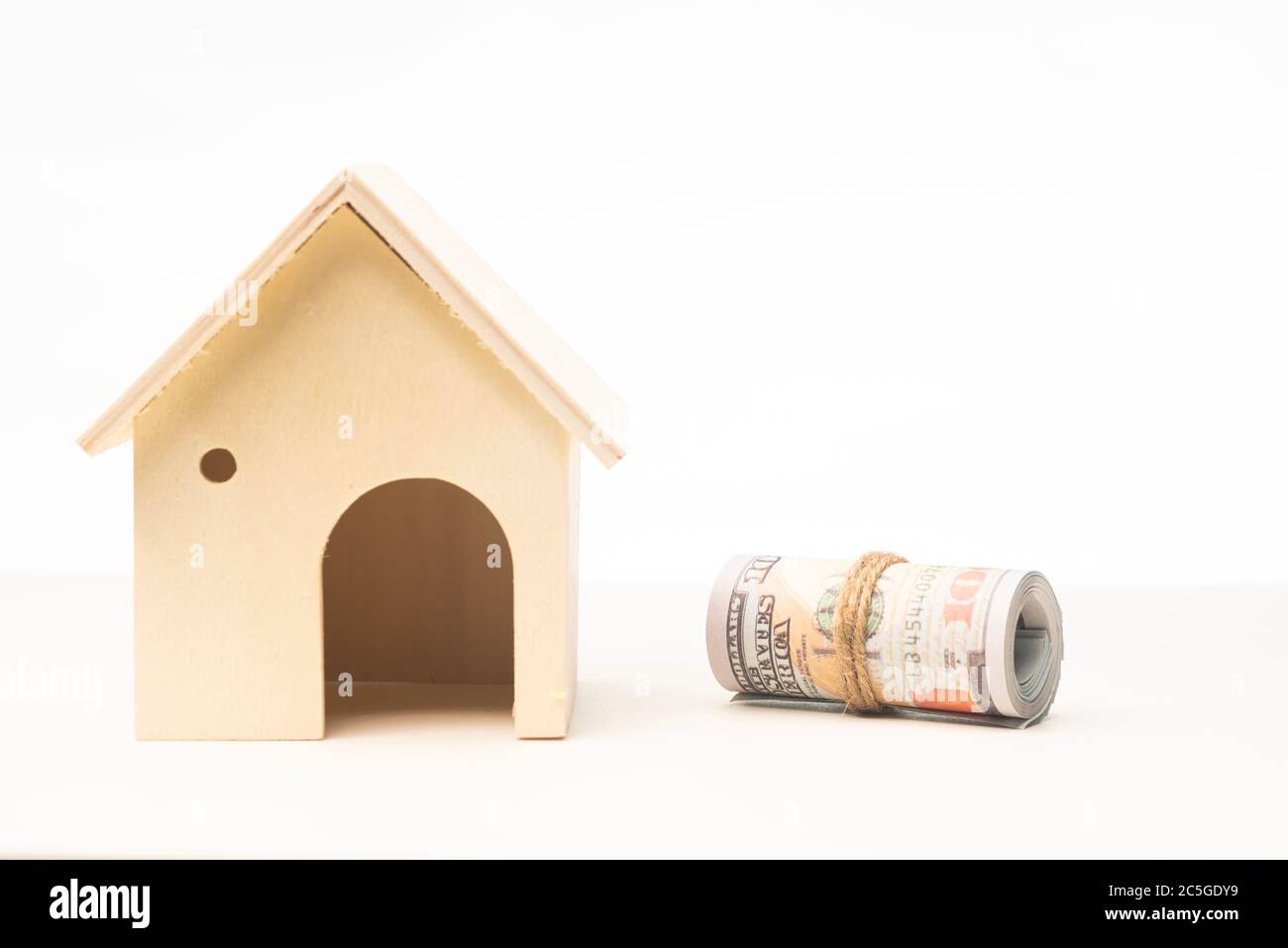 Miniature wooden house isolated against white background Stock Photo ...