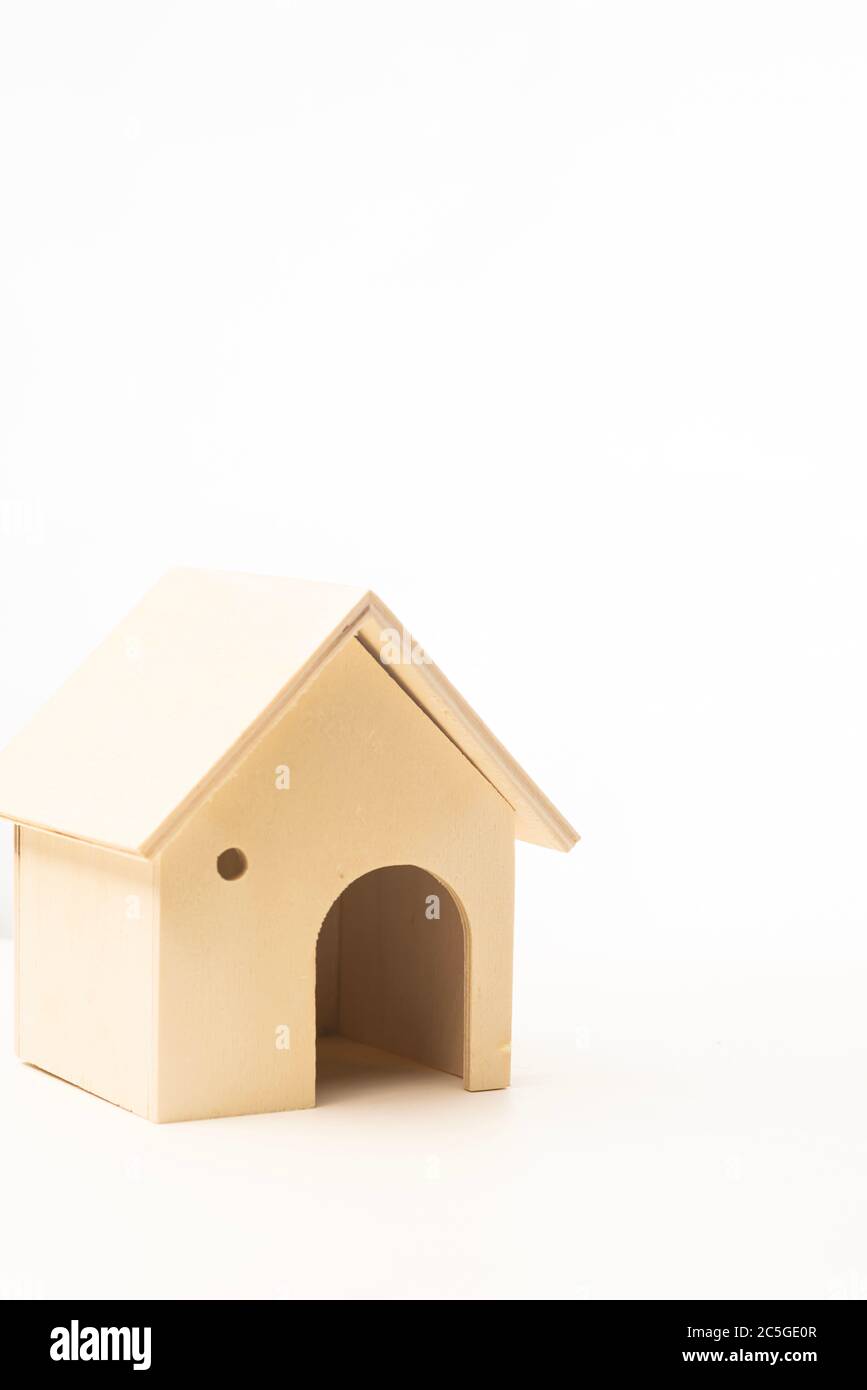 Miniature wooden house isolated against white background Stock Photo ...