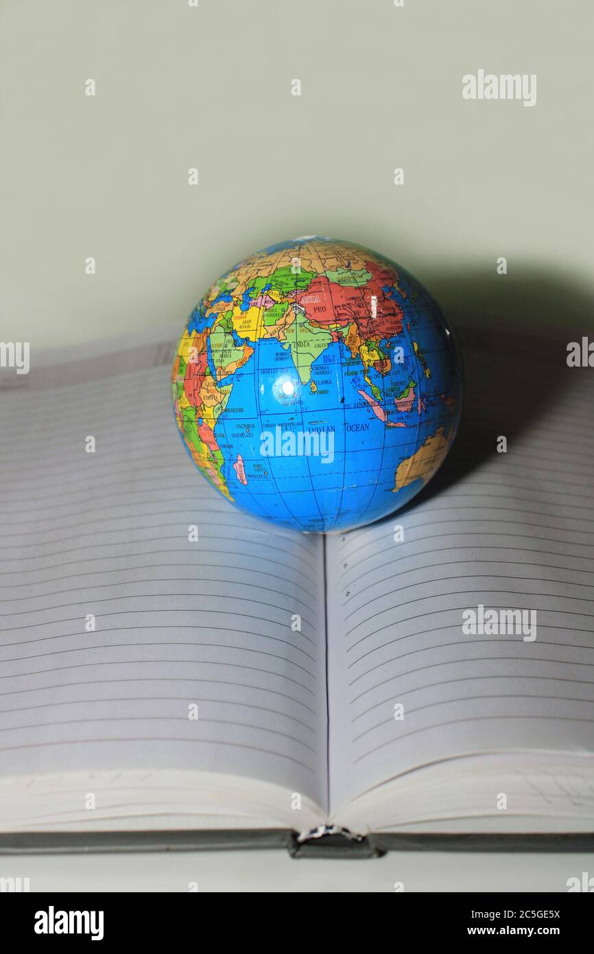 Earth globe on diary page. School globe on diary. Education concept Stock Photo