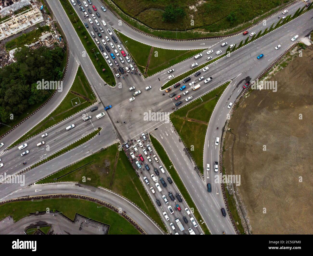 Top down view of road intersection with crowded vehicles Stock Photo