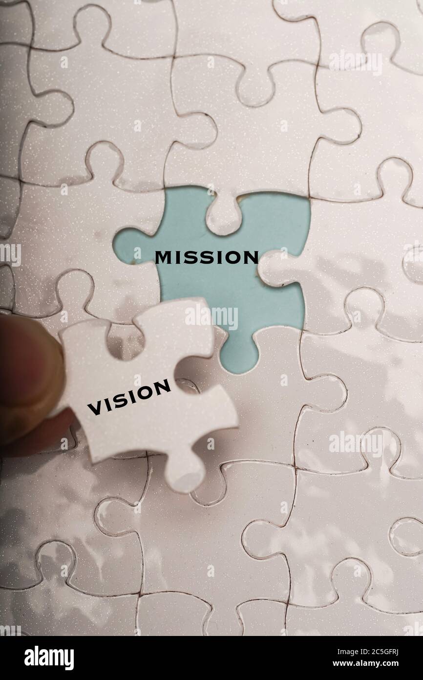 Business management concept: vision and mission wordings on puzzle ...