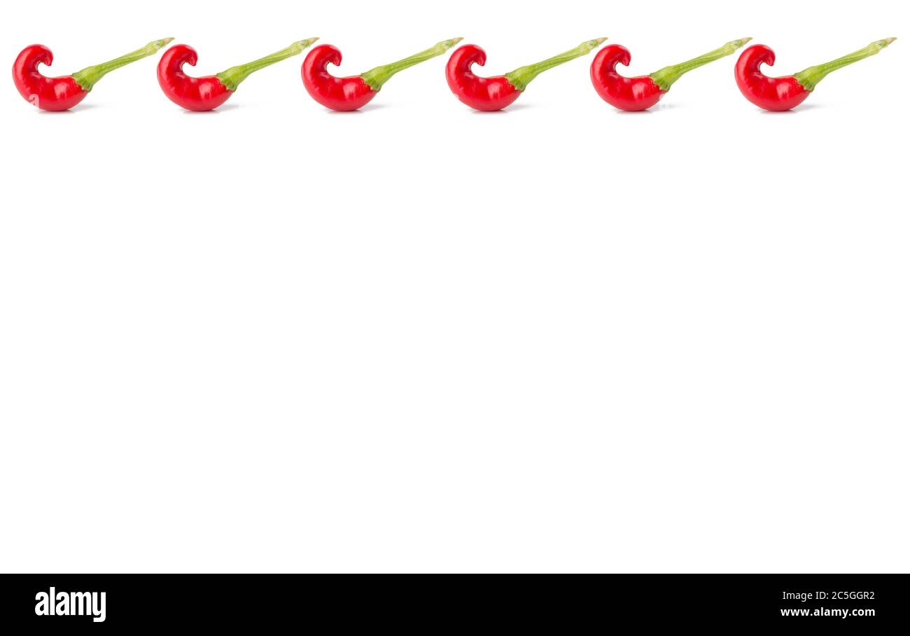 Row of repeated red Thai peppers across white banner, with shadows. Stock Photo