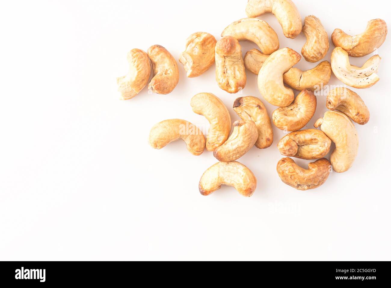 cashew-nuts-isolated-against-white-2C5GGYD.jpg