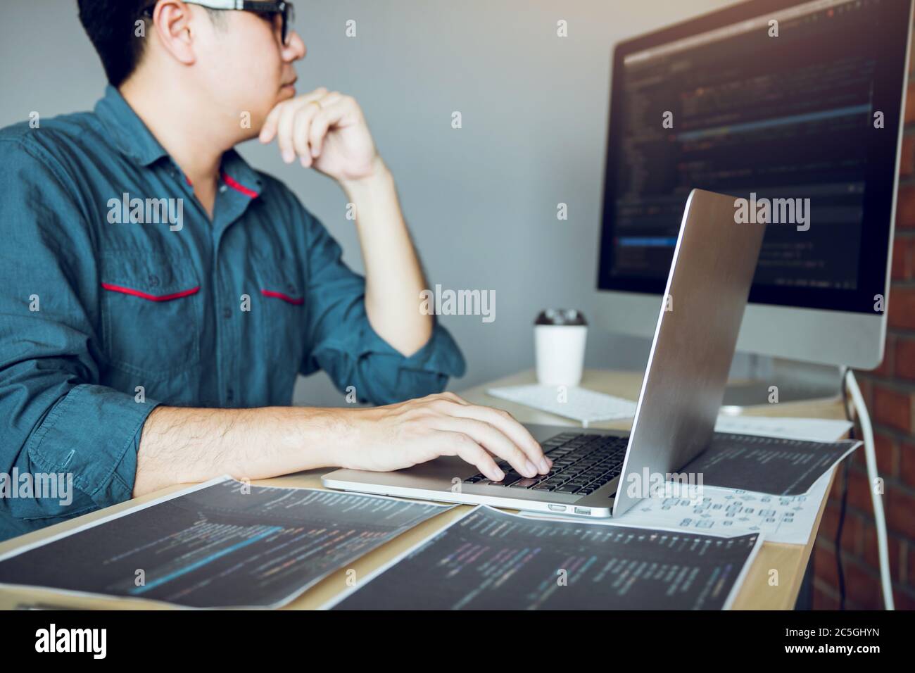 Developing programming and coding technology working in a software develop company office. Stock Photo