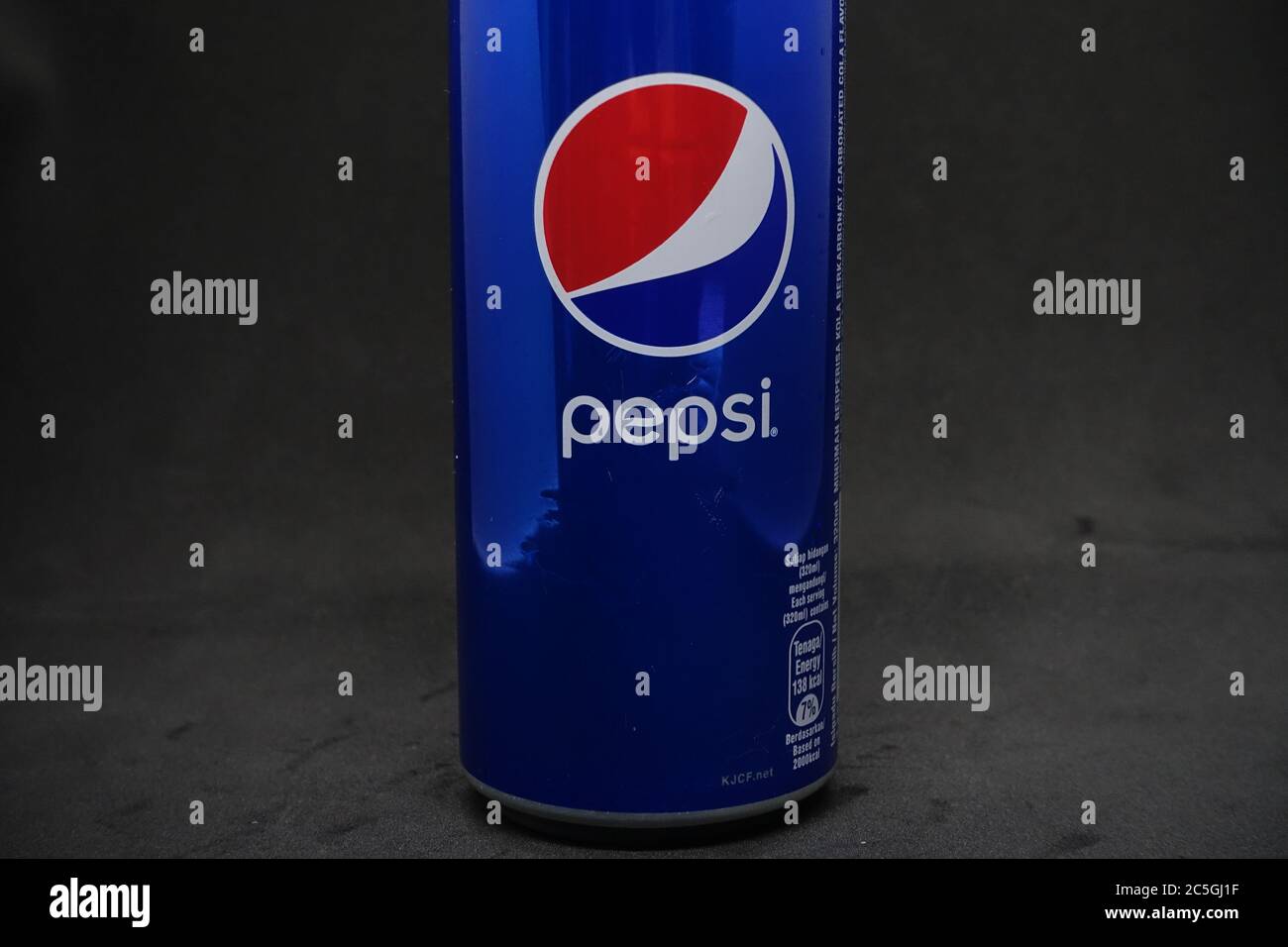 A can of blue pepsi against isolated black background Stock Photo - Alamy