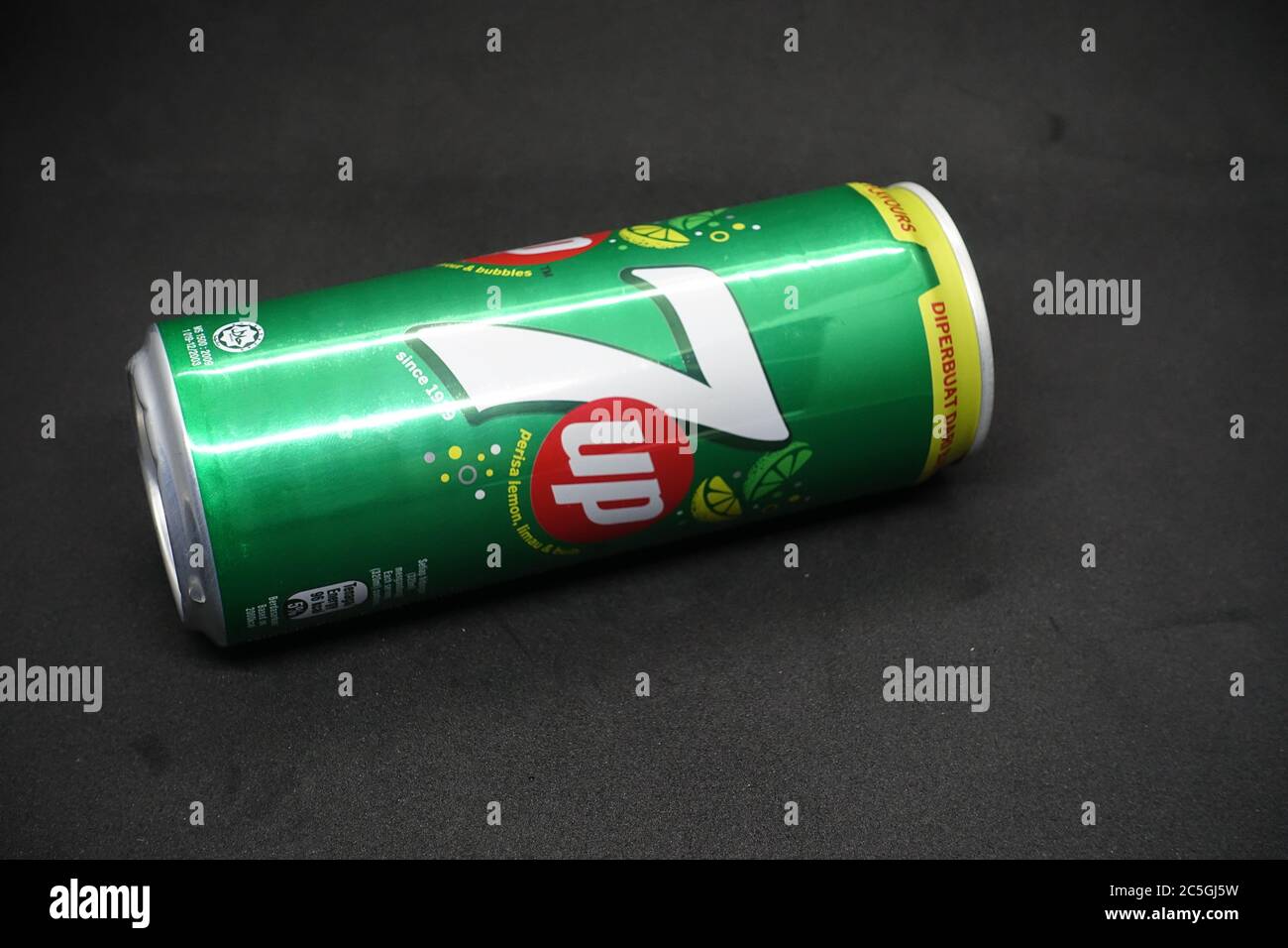 A 7up can against isolated black background, a tasty fruits flavour carbonated drink Stock Photo