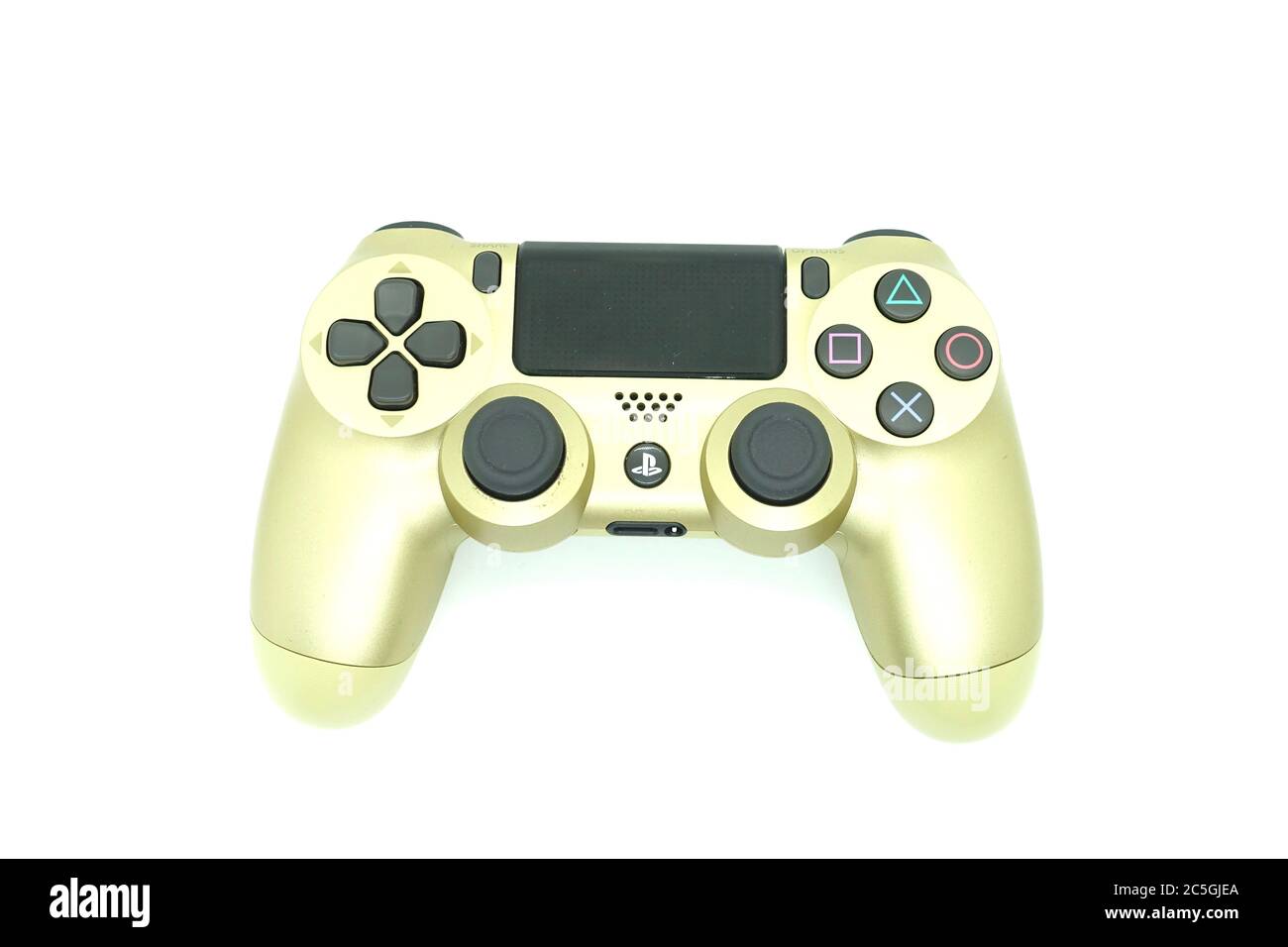 A gold colour Playstation 4 DS4 controller against isolated white  background Stock Photo - Alamy