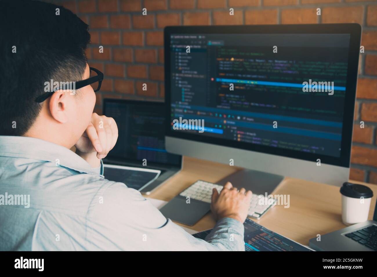 Developing programming and coding technology working in a software develop company office. Stock Photo