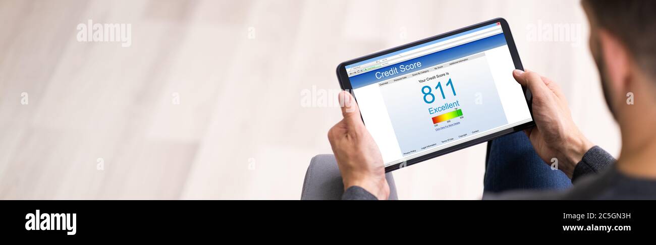 Online Credit Score Check Using Tablet Computer Stock Photo