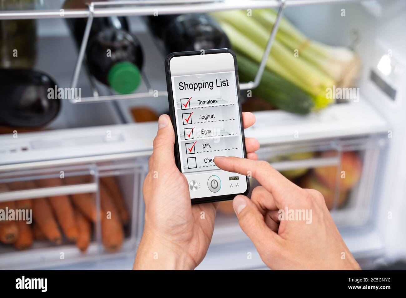 Consumer Grocery Shopping List App And Fridge Stock Photo Alamy
