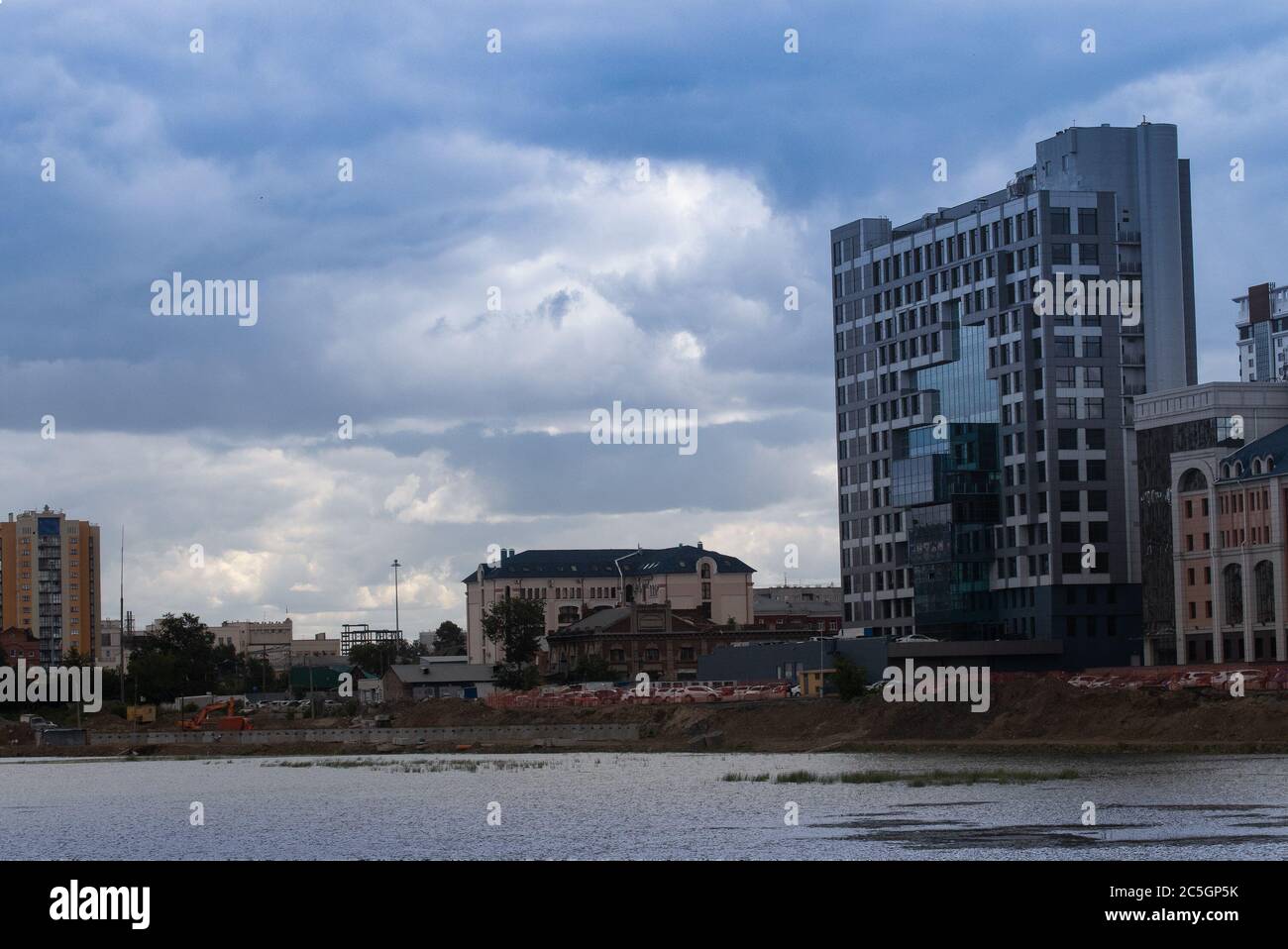 A multi-storey building on the banks of the Miass River, Chelyabinsk, Russia. Stock Photo
