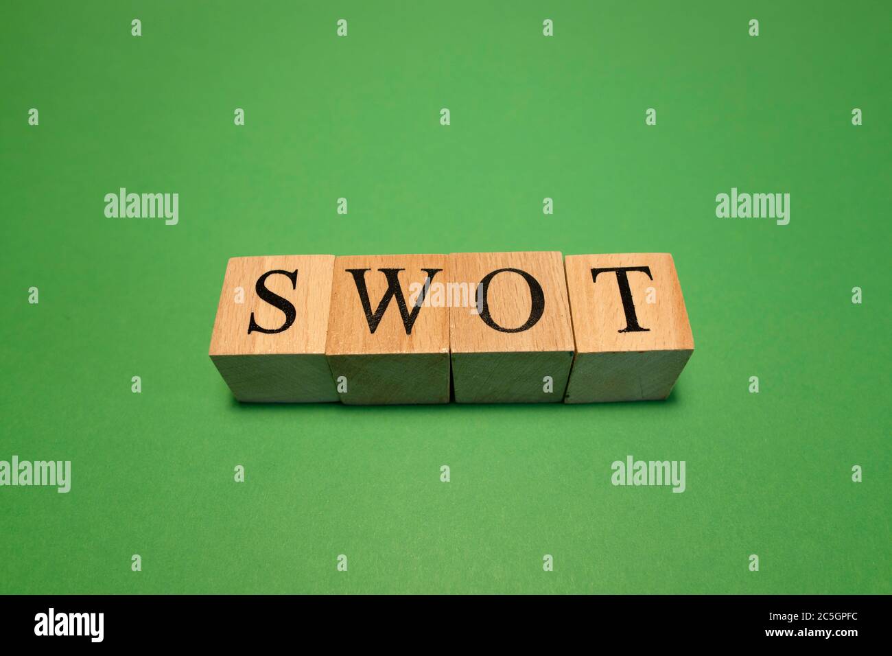 The word swot made from wooden cubes. Work and business concept. Stock Photo
