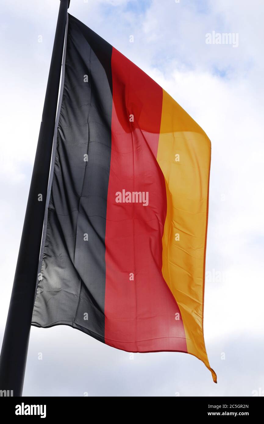 Deutsche Nationalfahne weht im Wind (German flag waving in the wind) Stock Photo