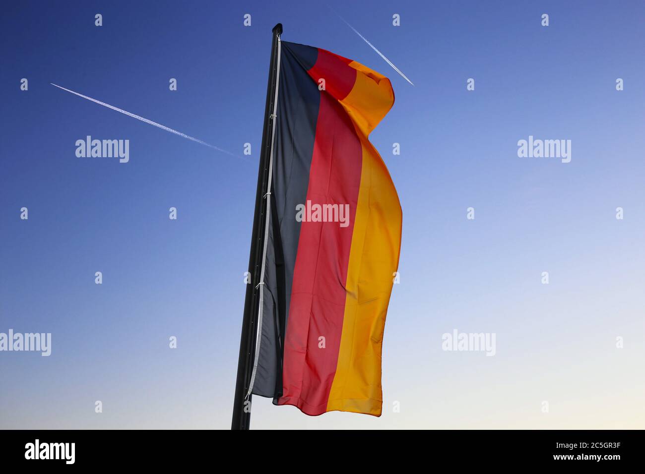 Deutsche Nationalfahne weht im Wind (German flag waving in the wind) Stock Photo