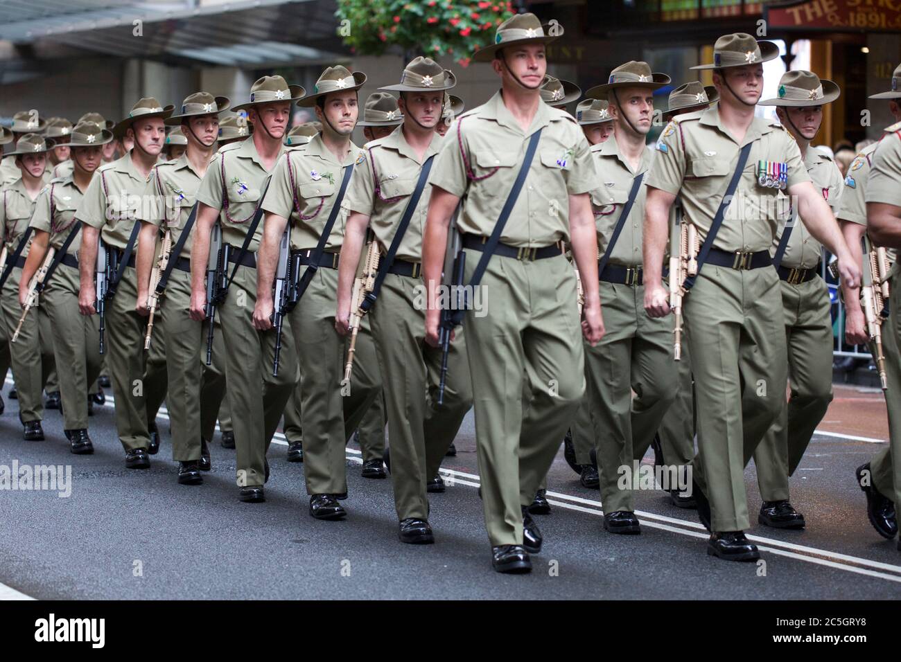 Military personnel march along George Street in the ANZAC Day Parade in ...