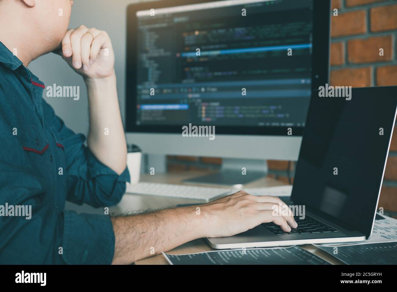 Developing programming and coding technology working in a software develop company office. Stock Photo