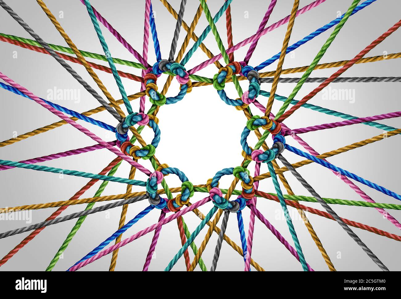 Group unity concept and teamwork as a business metaphor for joining a team as diverse groups of ropes connected together as a corporate symbol. Stock Photo