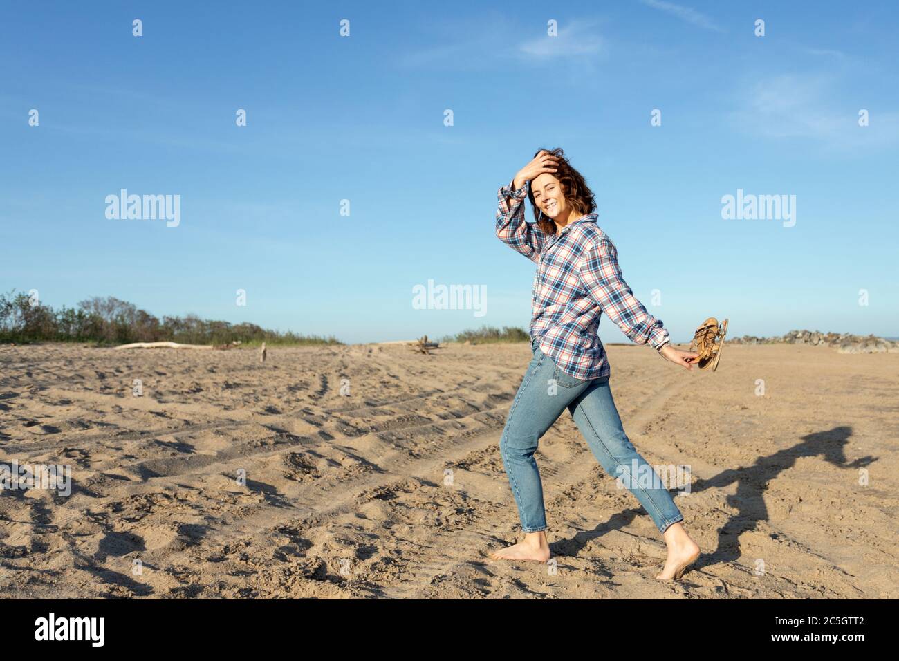 Outdoor atmospheric lifestyle photo of young beautiful darkhaired woman