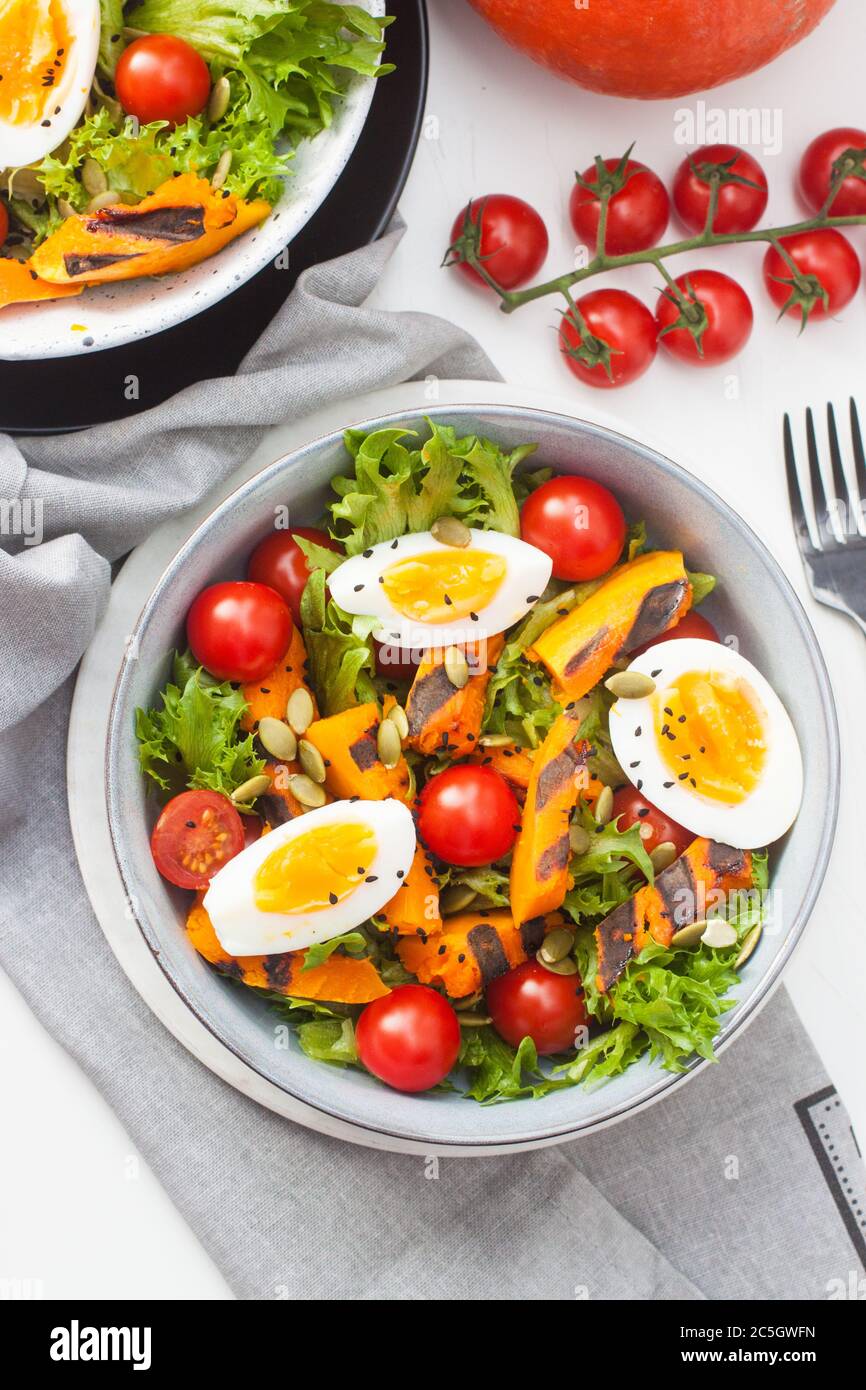 Vegetable salad with grilled carrot, cherry tomatoes, pumpkin, lettuce