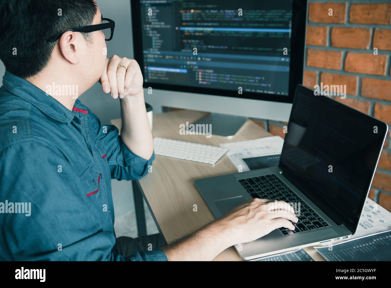 Developing programming and coding technology working in a software develop company office. Stock Photo