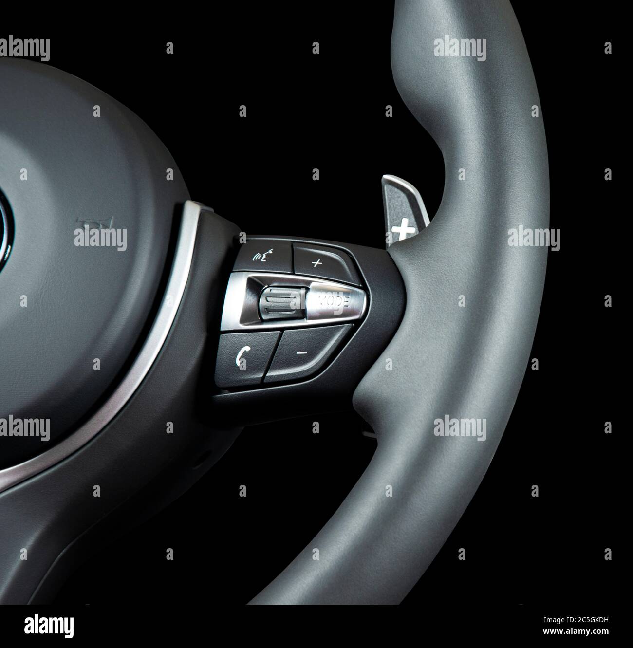 Part of modern steering wheel, isolated over black background Stock Photo