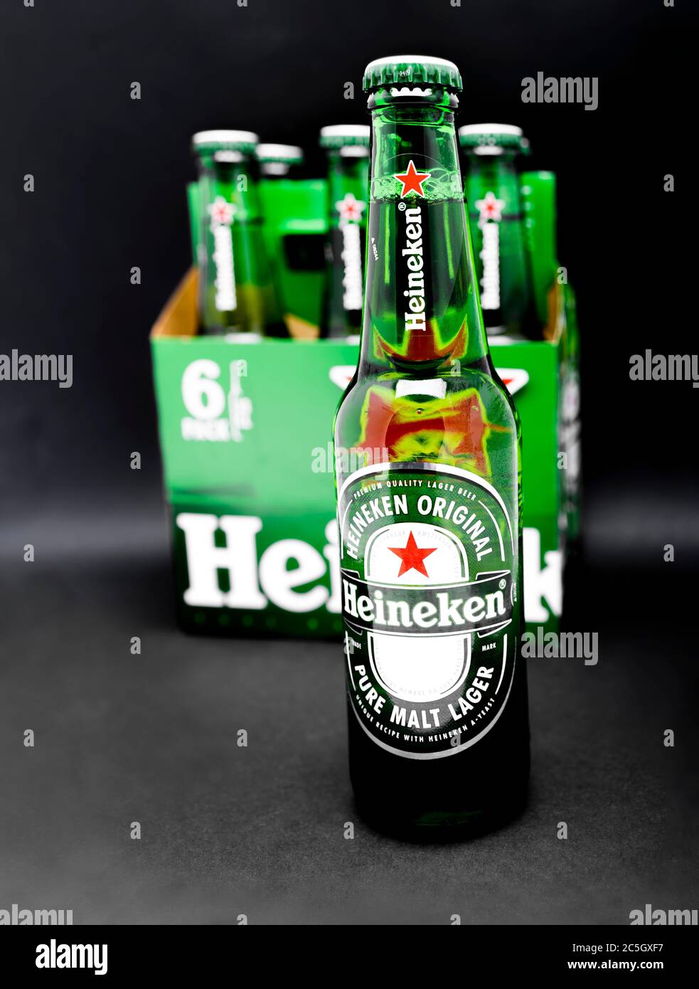 Sankt-Petersburg, Russia, Fenruary 02, 2020: Six pack of Heineken light lager beer on black background with one bottle on the foreground in focus stud Stock Photo