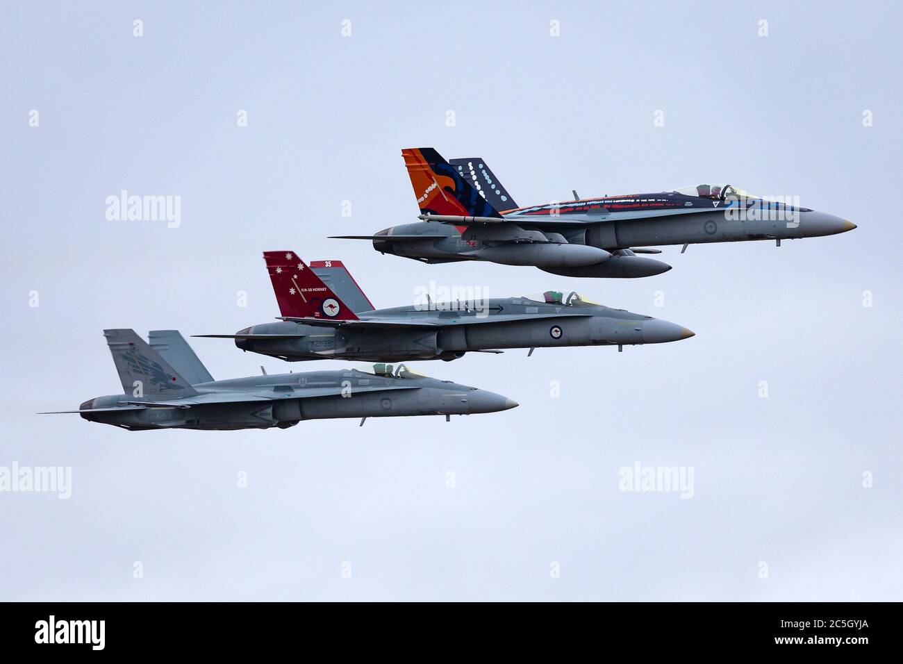 Formation of three Royal Australian Air Force (RAAF) McDonnell Douglas F/A-18 hornet multirole fighter aircraft. Stock Photo