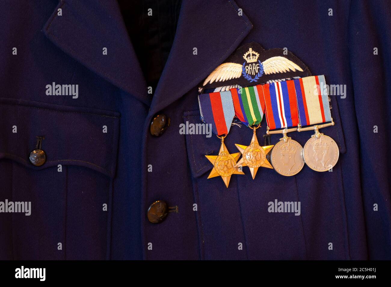 Four World War II service medals on a Royal Australian Air Force uniform jacket, the medals are thee 1939-45 Star, Pacific Star, War Medal and the Aus Stock Photo