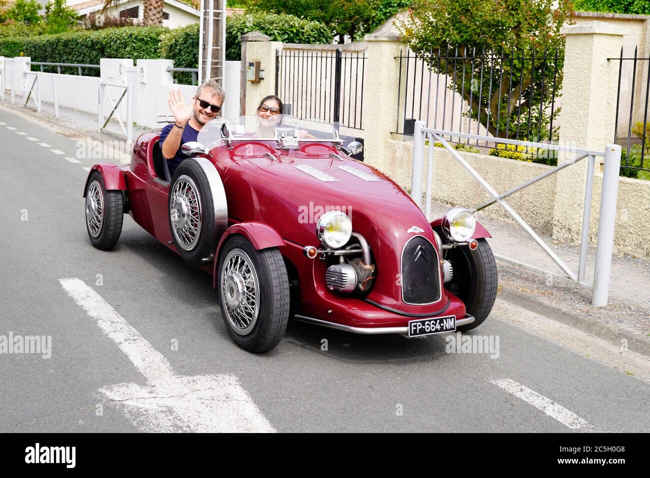 Bordeaux , Aquitaine / France - 06 20 2020 : Lomax Red car vintage roadster oldtimer in street from 2cv citroen Stock Photo