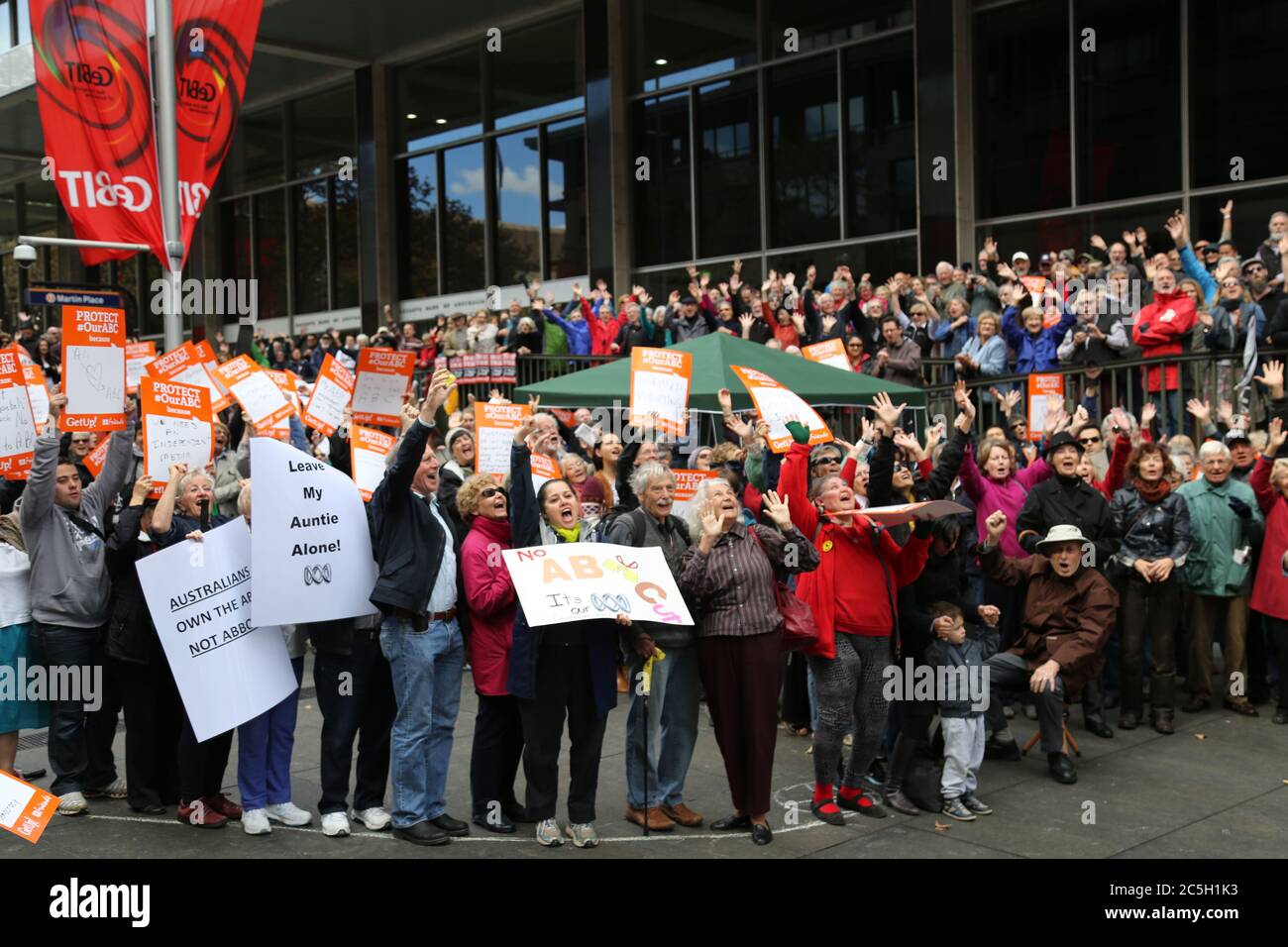 Protesters in Martin Place, Sydney say ‘hands off the ABC’ as they pose ...