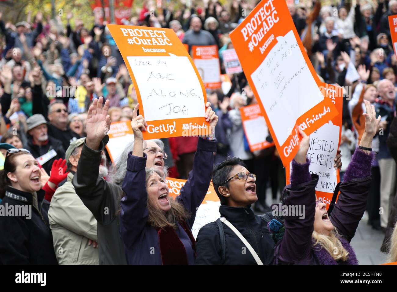 Protesters in Martin Place, Sydney say ‘hands off the ABC’ as they pose ...