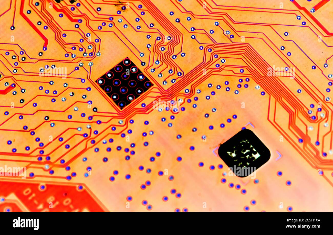 Abstract red computer circuit board close up for background Stock Photo