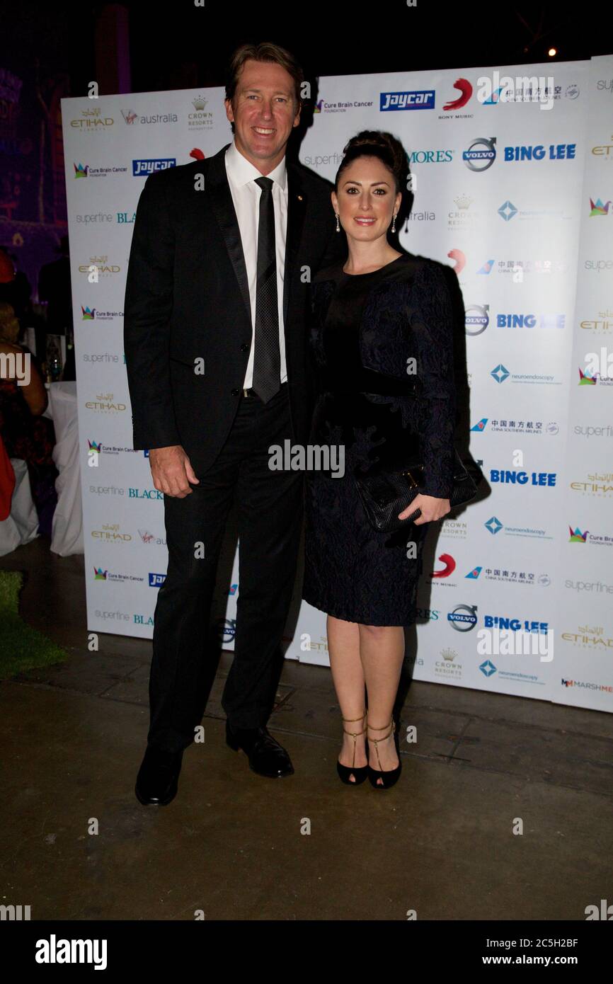 Glen McGrath and Sara Leonardi arrive for the Cure Brain Cancer Foundation Mad Hatter Ball at