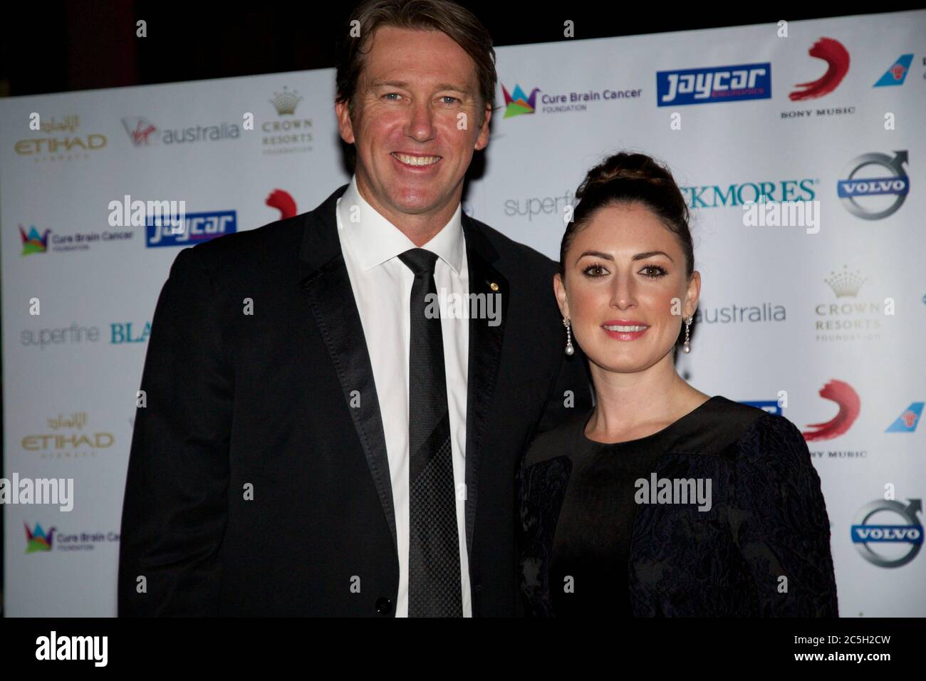 Glen McGrath and Sara Leonardi arrive for the Cure Brain Cancer Foundation Mad Hatter Ball at