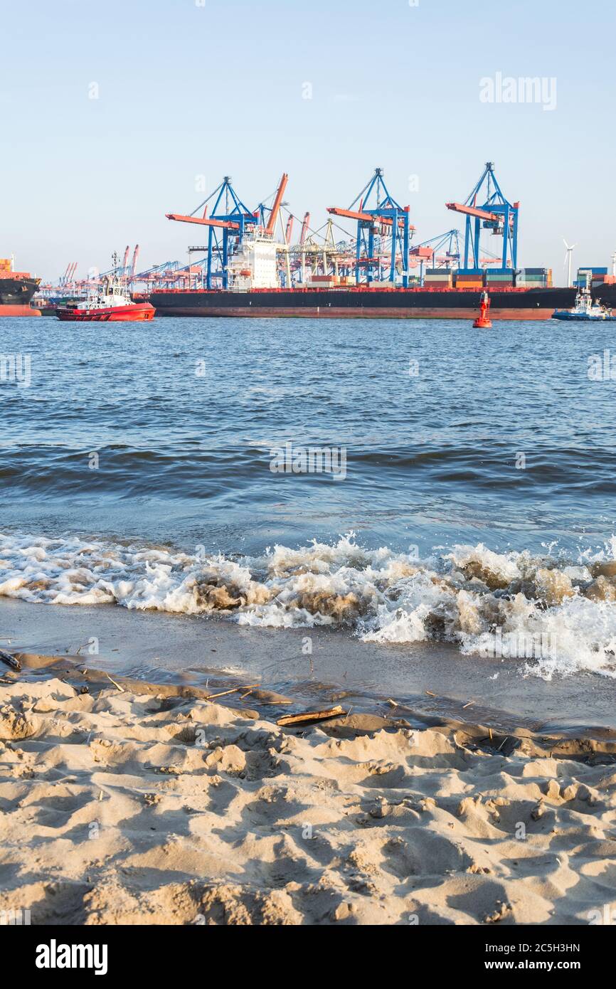 Elbe beach with container terminal and ships in Hamburg Stock Photo - Alamy