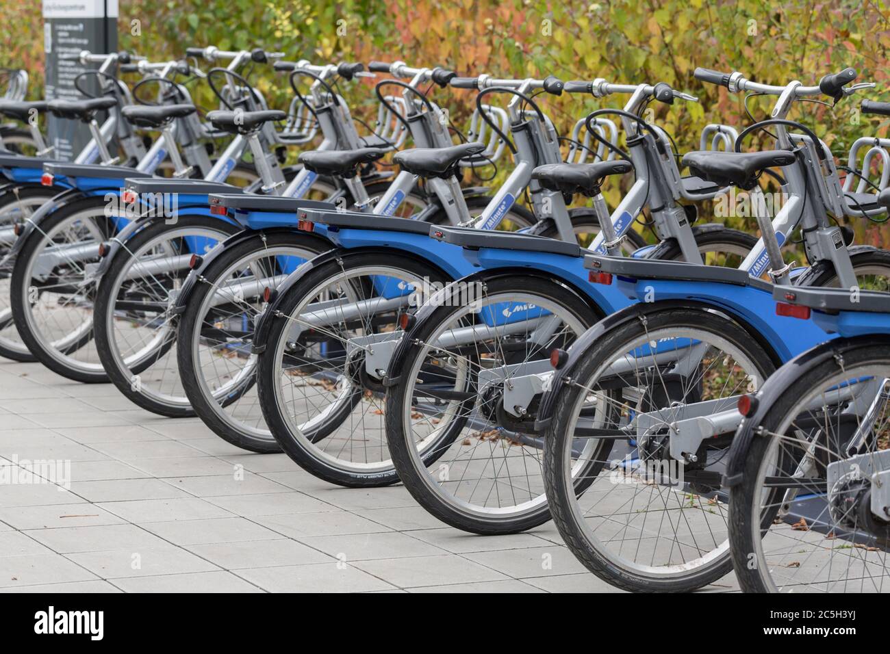 View on bicycles in a row at a rental station. Stock Photo