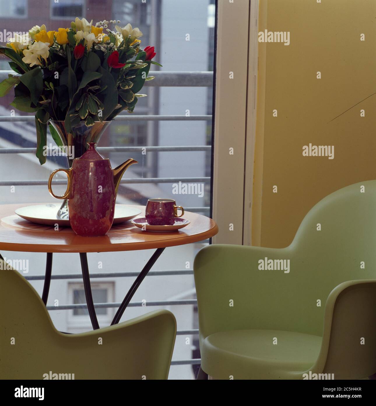 Detail of corner of room with chairs and table in window Stock Photo
