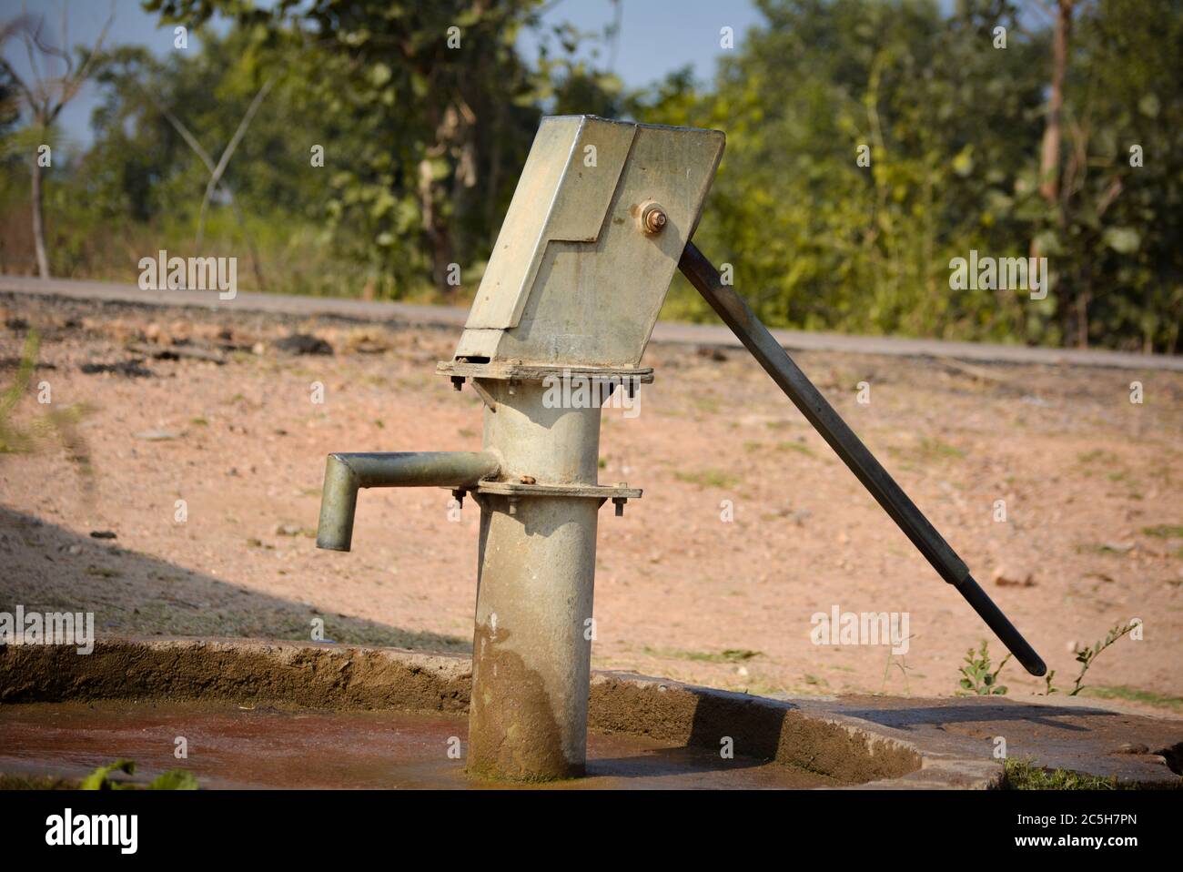 Old hand operated water pump in rural India Stock Photo