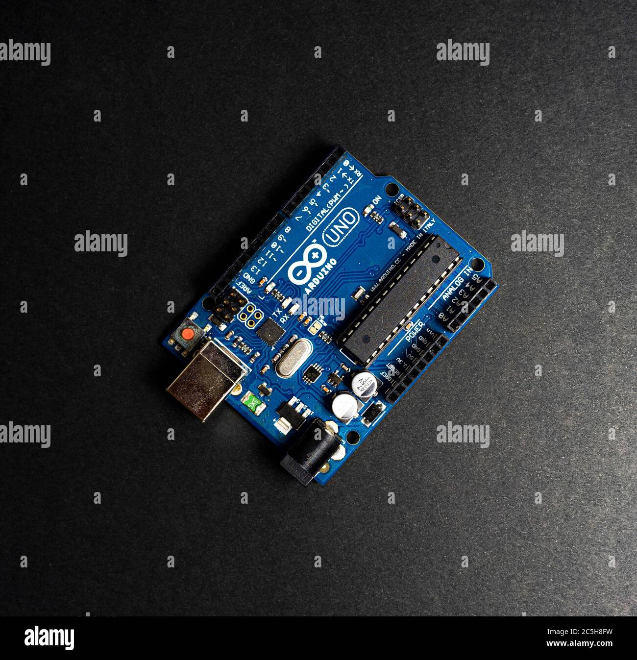 Sankt-Petersburg, Russia - February 28, 2020: Arduino UNO board on black background, close up. Microcontroller for programming. Stock Photo