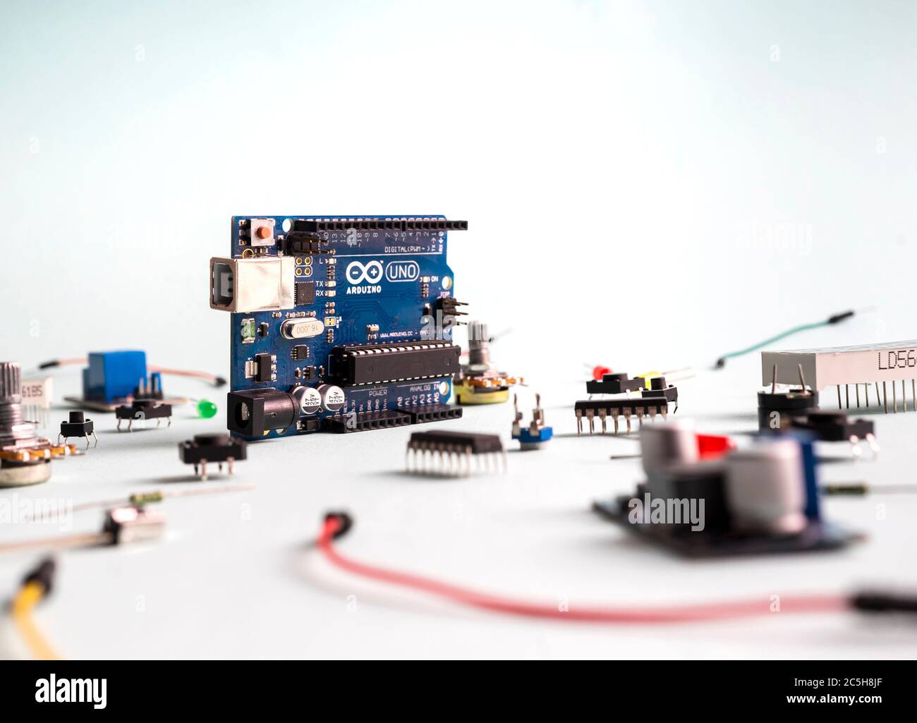 Sankt-Petersburg, Russia - February 28, 2020: Arduino UNO board on light background. Micro eleectronics arduino DIY components. Microcontrollers, boar Stock Photo
